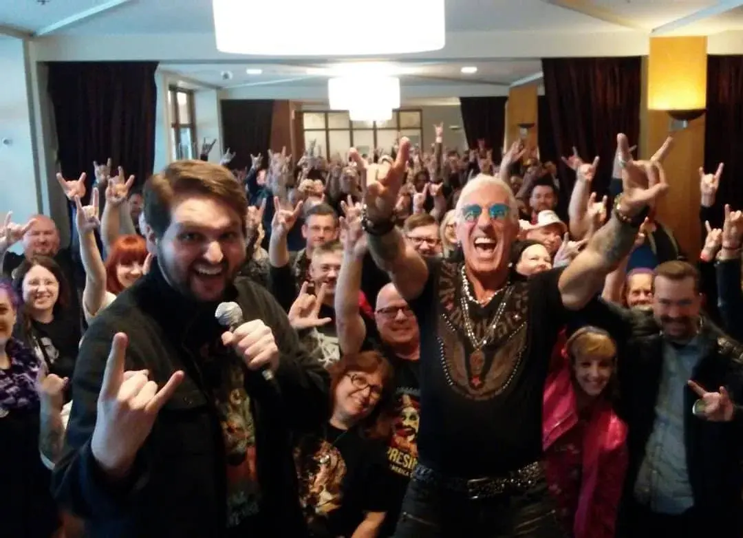 Tommy Brunswick surrounded by an energetic group of attendees at Motor City Nightmares